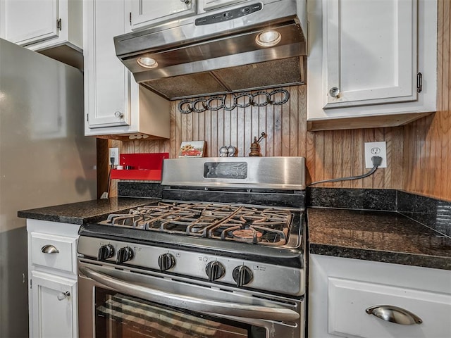 1209 Dakota St, Norman, OK 73069 - kitchen with stainless steel range with gas stovetop, range hood, white cabinetry, and dark countertops