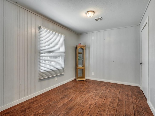 1209 Dakota St, Norman, OK 73069 - unfurnished room featuring wood-type flooring and crown molding