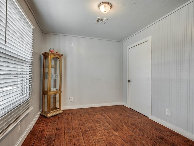 1209 Dakota St, Norman, OK 73069 - empty room with hardwood / wood-style flooring and crown molding