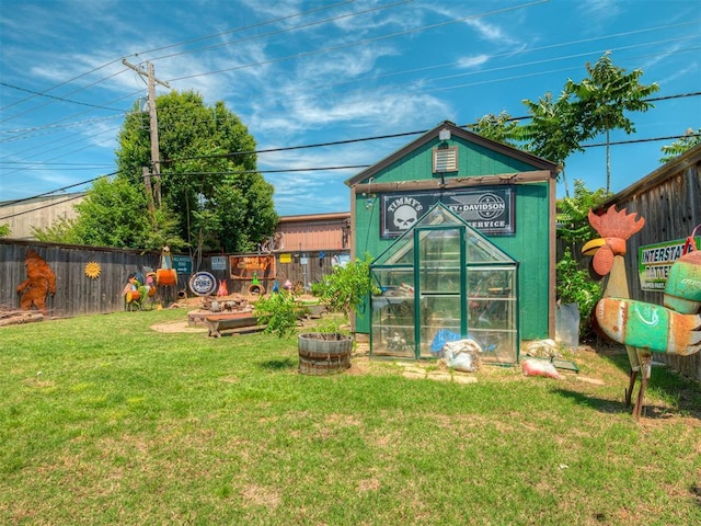 1209 Dakota St, Norman, OK 73069 - rear view of house featuring an exterior structure and an outbuilding