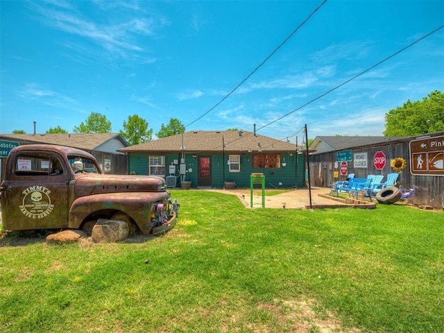1209 Dakota St, Norman, OK 73069 - rear view of property with a yard
