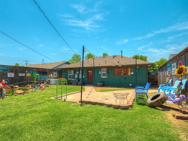 1209 Dakota St, Norman, OK 73069 - rear view of property featuring a fenced backyard and a patio area