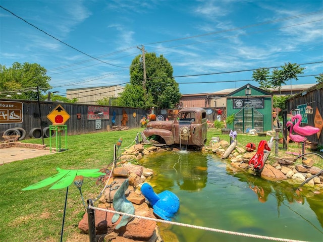 1209 Dakota St, Norman, OK 73069 - view of yard with a greenhouse and an outdoor structure