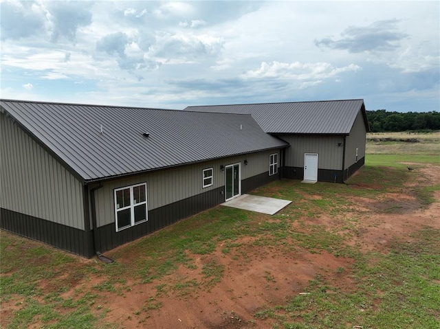17008 County St Unit 2750, Minco, OK 73059 - rear view of property with a metal roof and a patio area