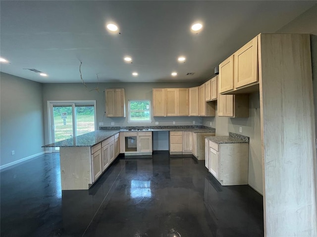 17008 County St Unit 2750, Minco, OK 73059 - kitchen with a peninsula, concrete floors, recessed lighting, and stone counters