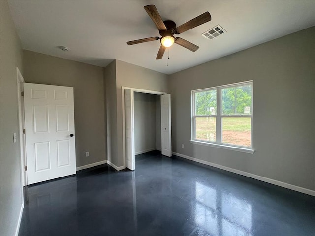 17008 County St Unit 2750, Minco, OK 73059 - unfurnished bedroom featuring concrete floors, a closet, and a ceiling fan