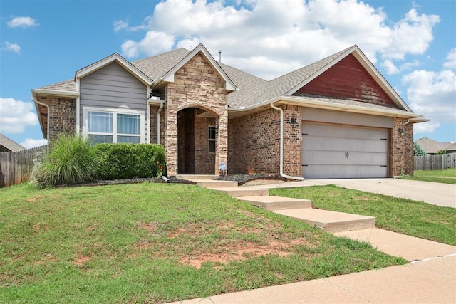 8401 NW 140th St, Oklahoma City, OK 73142 - view of front facade with a garage, driveway, brick siding, and roof with shingles