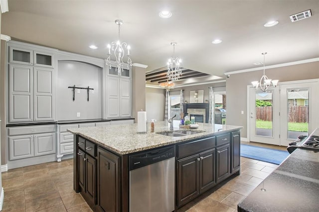 8401 NW 140th St, Oklahoma City, OK 73142 - kitchen featuring stainless steel dishwasher, a chandelier, glass insert cabinets, a kitchen island with sink, and recessed lighting