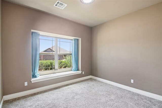 8401 NW 140th St, Oklahoma City, OK 73142 - carpeted spare room featuring baseboards