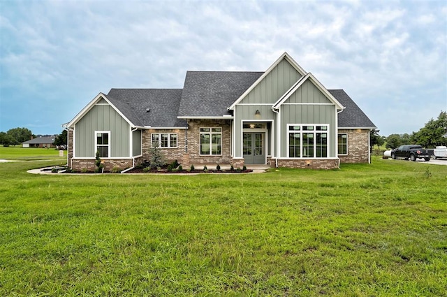 1801 Cedar Valley Mnr, Guthrie, OK 73044 - rear view of house with french doors, board and batten siding, brick siding, a lawn, and a shingled roof