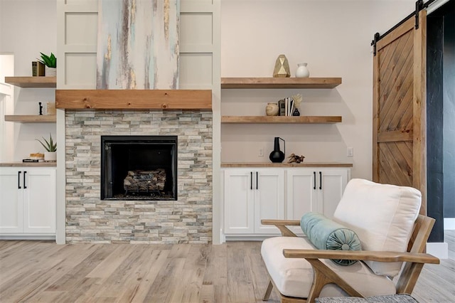 1801 Cedar Valley Mnr, Guthrie, OK 73044 - sitting room featuring light wood-type flooring and a barn door