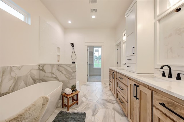 1801 Cedar Valley Mnr, Guthrie, OK 73044 - bathroom featuring a soaking tub, double vanity, recessed lighting, marble finish flooring, and a shower