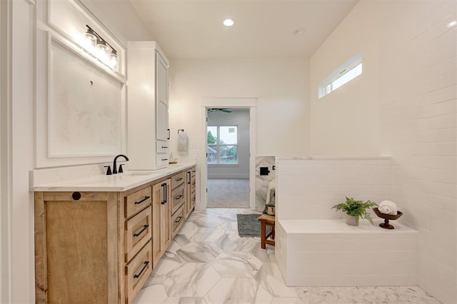 1801 Cedar Valley Mnr, Guthrie, OK 73044 - bathroom with healthy amount of natural light, vanity, marble finish flooring, a garden tub, and recessed lighting