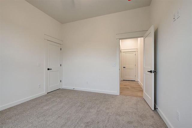 1801 Cedar Valley Mnr, Guthrie, OK 73044 - unfurnished bedroom featuring light colored carpet and baseboards