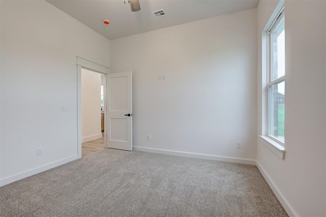 1801 Cedar Valley Mnr, Guthrie, OK 73044 - unfurnished room with light carpet, healthy amount of natural light, and a ceiling fan