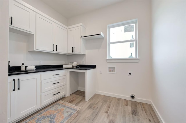 1801 Cedar Valley Mnr, Guthrie, OK 73044 - laundry room featuring hookup for a washing machine, electric dryer hookup, light wood-style floors, and cabinet space