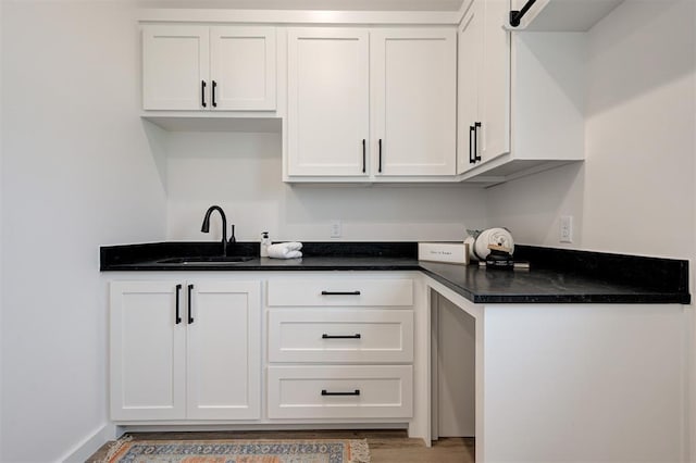 1801 Cedar Valley Mnr, Guthrie, OK 73044 - kitchen featuring white cabinetry and light wood-style flooring