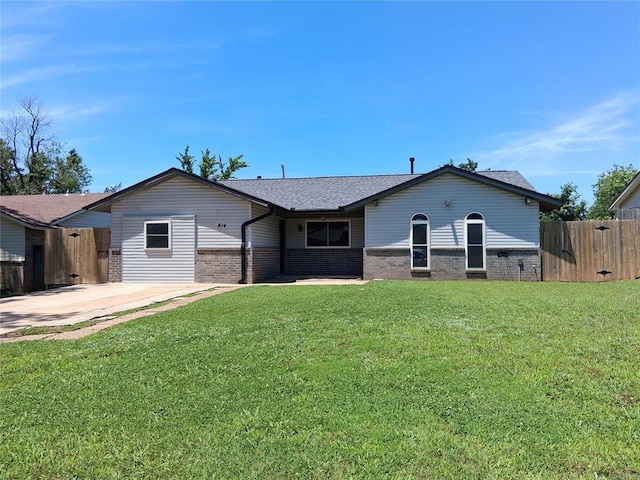 814 E Midland St, Shawnee, OK 74804 - rear view of property with brick siding and a shingled roof