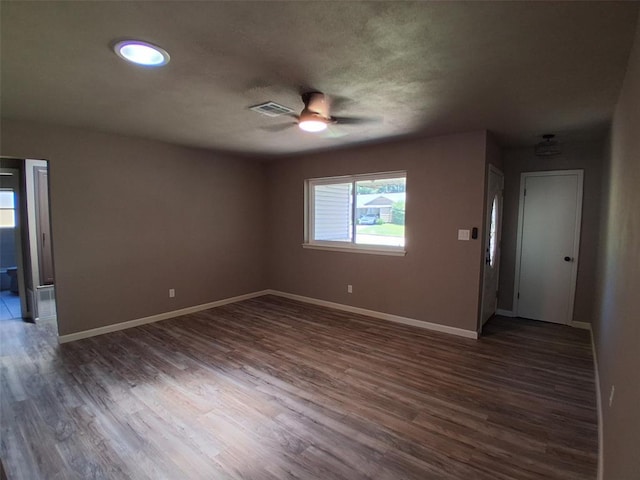 814 E Midland St, Shawnee, OK 74804 - spare room with a ceiling fan, dark wood-type flooring, and a textured ceiling