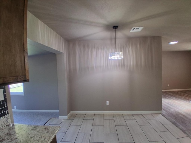 814 E Midland St, Shawnee, OK 74804 - unfurnished dining area with a chandelier and a fireplace