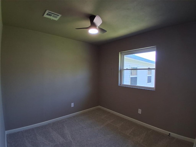 814 E Midland St, Shawnee, OK 74804 - unfurnished room featuring a ceiling fan and dark carpet
