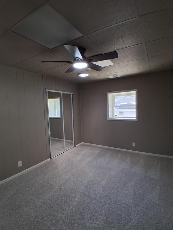 814 E Midland St, Shawnee, OK 74804 - empty room featuring a ceiling fan, carpet, and a paneled ceiling