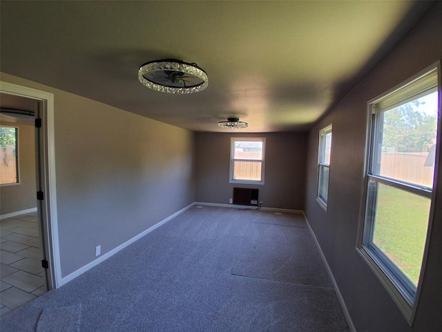 814 E Midland St, Shawnee, OK 74804 - carpeted empty room featuring baseboards