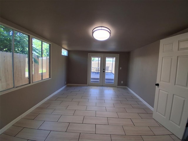 814 E Midland St, Shawnee, OK 74804 - spare room featuring french doors and baseboards