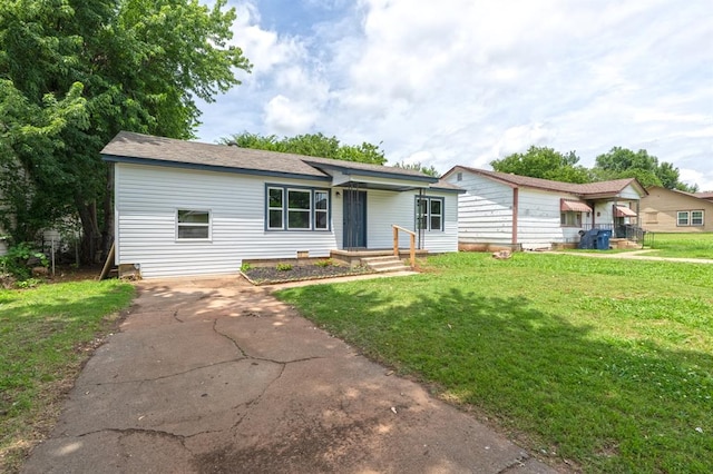 239 SE 48th St, Oklahoma City, OK 73129 - ranch-style home with a front yard and driveway