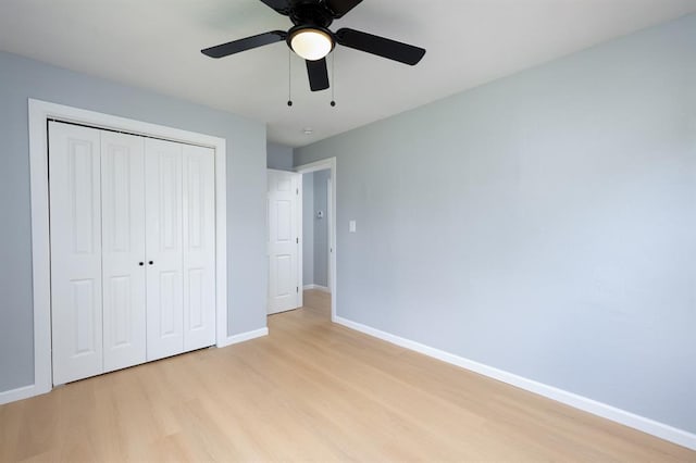 239 SE 48th St, Oklahoma City, OK 73129 - unfurnished bedroom with light wood finished floors, a closet, and a ceiling fan