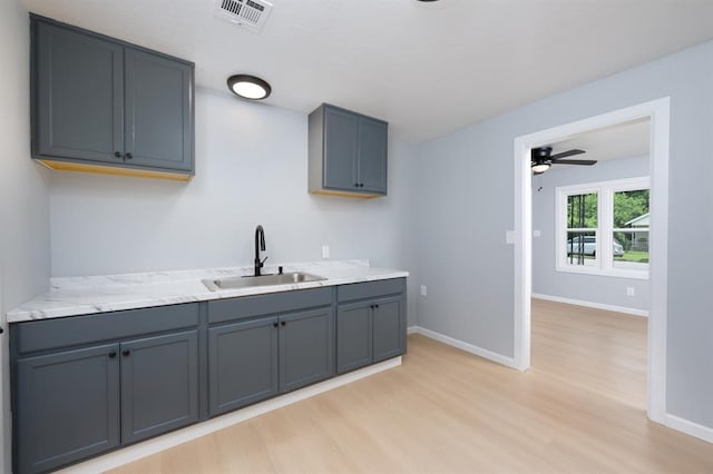 239 SE 48th St, Oklahoma City, OK 73129 - kitchen featuring light wood-style floors and ceiling fan