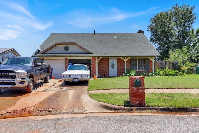 4904 Washington St, Oklahoma City, OK 73135 - view of front facade with brick siding, a garage, and driveway