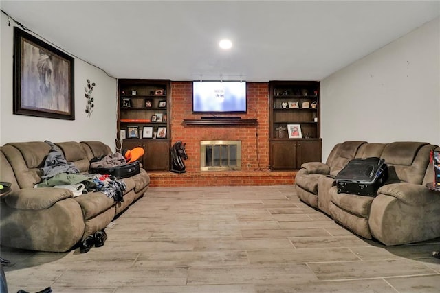 4904 Washington St, Oklahoma City, OK 73135 - living area with light wood-type flooring, built in shelves, and a brick fireplace