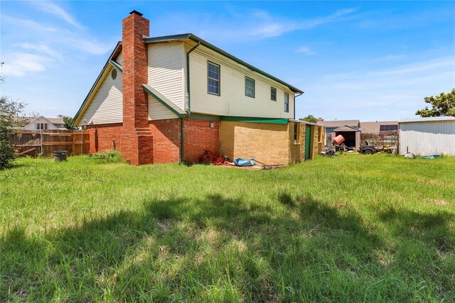 4904 Washington St, Oklahoma City, OK 73135 - rear view of property with a chimney