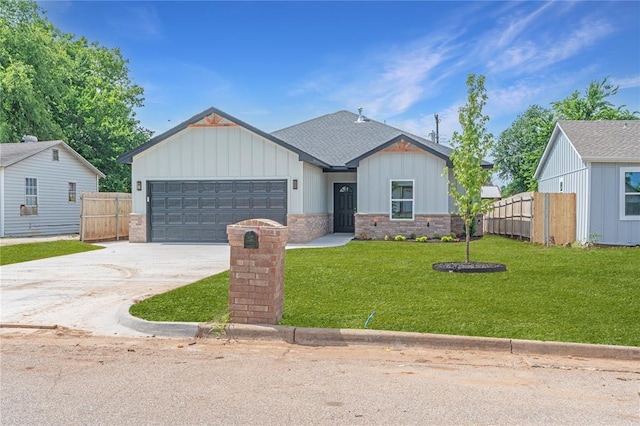 316 SE 45th St, Oklahoma City, OK 73129 - view of front facade featuring board and batten siding, concrete driveway, a garage, brick siding, and a shingled roof
