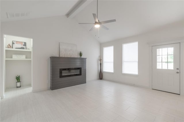 316 SE 45th St, Oklahoma City, OK 73129 - unfurnished living room featuring ceiling fan and a glass covered fireplace