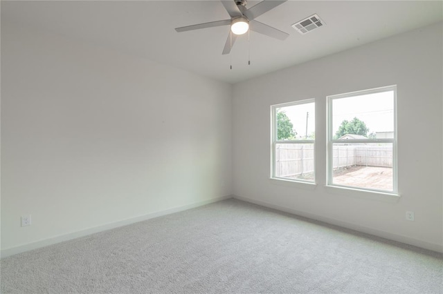 316 SE 45th St, Oklahoma City, OK 73129 - empty room with light carpet and a ceiling fan