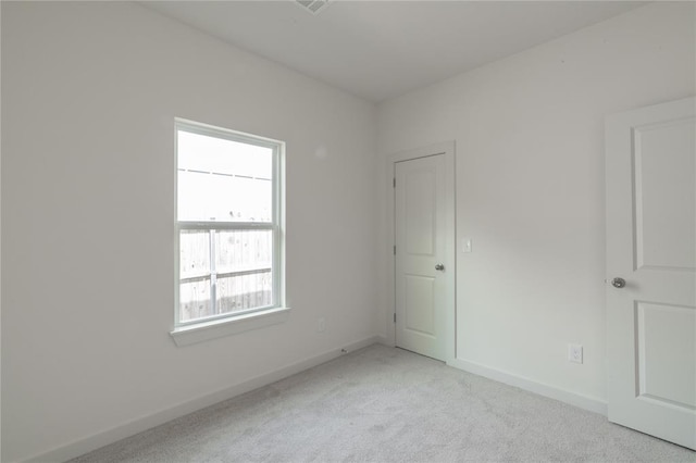 316 SE 45th St, Oklahoma City, OK 73129 - unfurnished bedroom with light colored carpet and baseboards