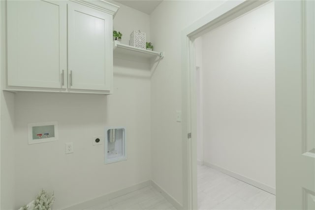 316 SE 45th St, Oklahoma City, OK 73129 - laundry room featuring electric dryer hookup, washer hookup, and cabinet space