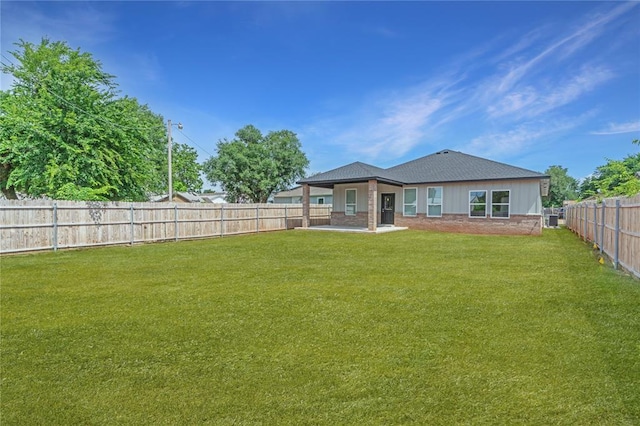 316 SE 45th St, Oklahoma City, OK 73129 - rear view of house with a fenced backyard and a patio