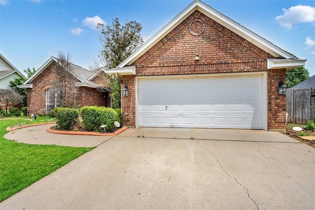 817 NW 76th St, Lawton, OK 73505 - ranch-style house featuring brick siding, concrete driveway, and a garage