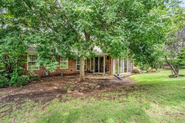 817 NW 76th St, Lawton, OK 73505 - view of green lawn featuring a sunroom