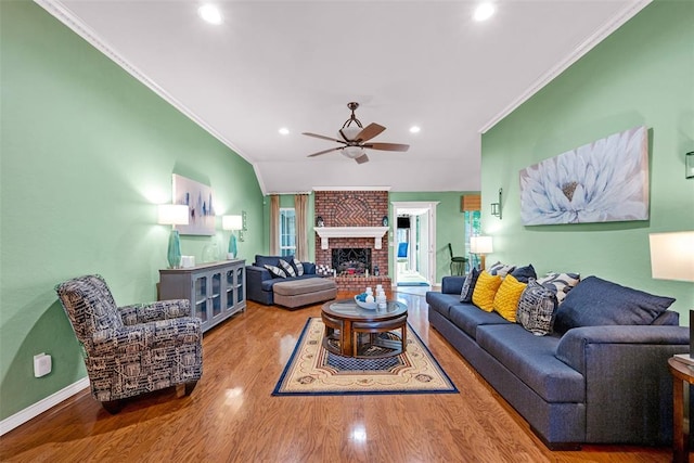 817 NW 76th St, Lawton, OK 73505 - living area with ceiling fan, crown molding, wood finished floors, recessed lighting, and a brick fireplace