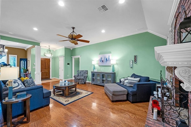 817 NW 76th St, Lawton, OK 73505 - living room featuring wood finished floors, crown molding, a ceiling fan, recessed lighting, and vaulted ceiling