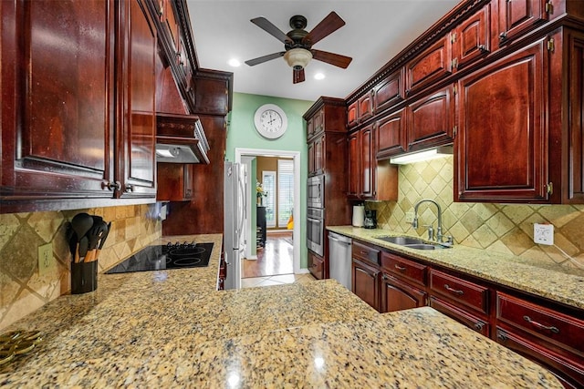 817 NW 76th St, Lawton, OK 73505 - kitchen featuring dark brown cabinets, stainless steel appliances, light stone counters, a ceiling fan, and recessed lighting