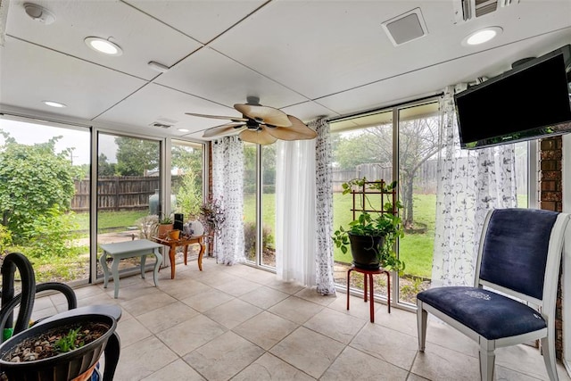 817 NW 76th St, Lawton, OK 73505 - sunroom with a wall of windows, a ceiling fan, and tile patterned flooring