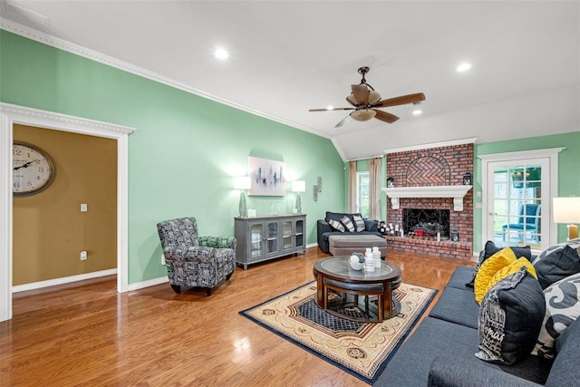 817 NW 76th St, Lawton, OK 73505 - living area with ceiling fan, ornamental molding, healthy amount of natural light, wood finished floors, and a fireplace