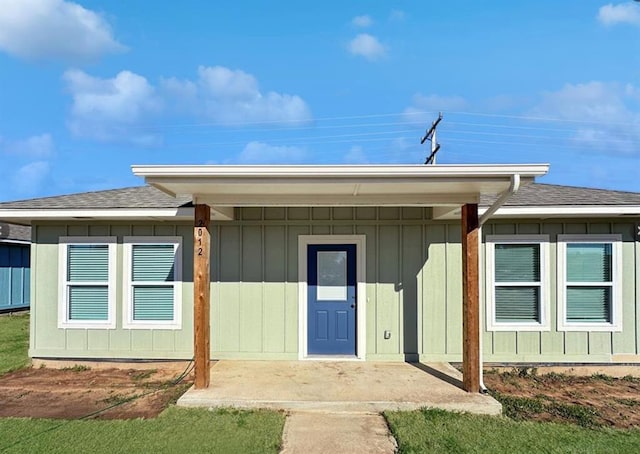 122 Sterling Dr, Chickasha, OK 73018 - view of exterior entry with a shingled roof