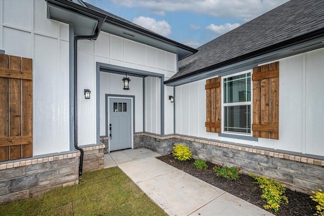 1890 E Industrial Rd, Guthrie, OK 73044 - entrance to property featuring stone siding, board and batten siding, and a shingled roof