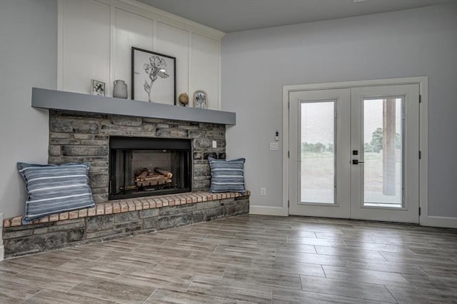 1890 E Industrial Rd, Guthrie, OK 73044 - living area with a fireplace with raised hearth and french doors